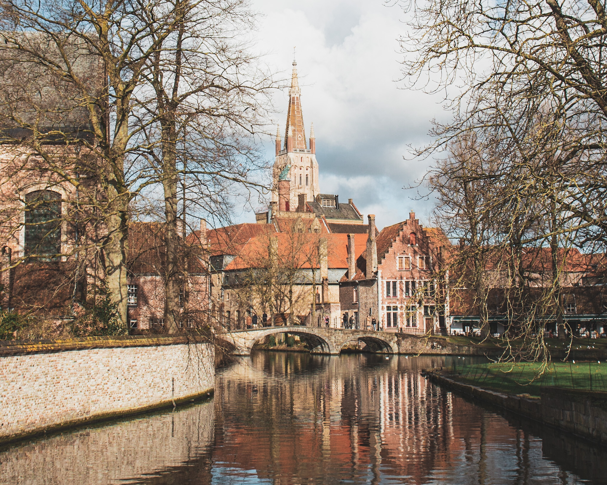 Riverside view of a bridge and the church tower